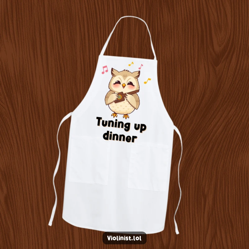 Funny owl apron showing a content owl playing a musical instrument with a serene smile, ready to cook with peaceful humor.