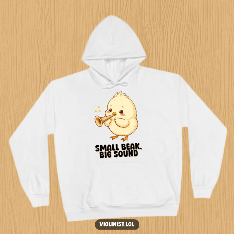 Funny, cozy hoodie showcasing a fluffy chick playing a tiny trumpet, radiating cheerful, musical vibes.